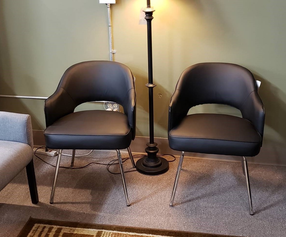 Two gray guest chairs in office