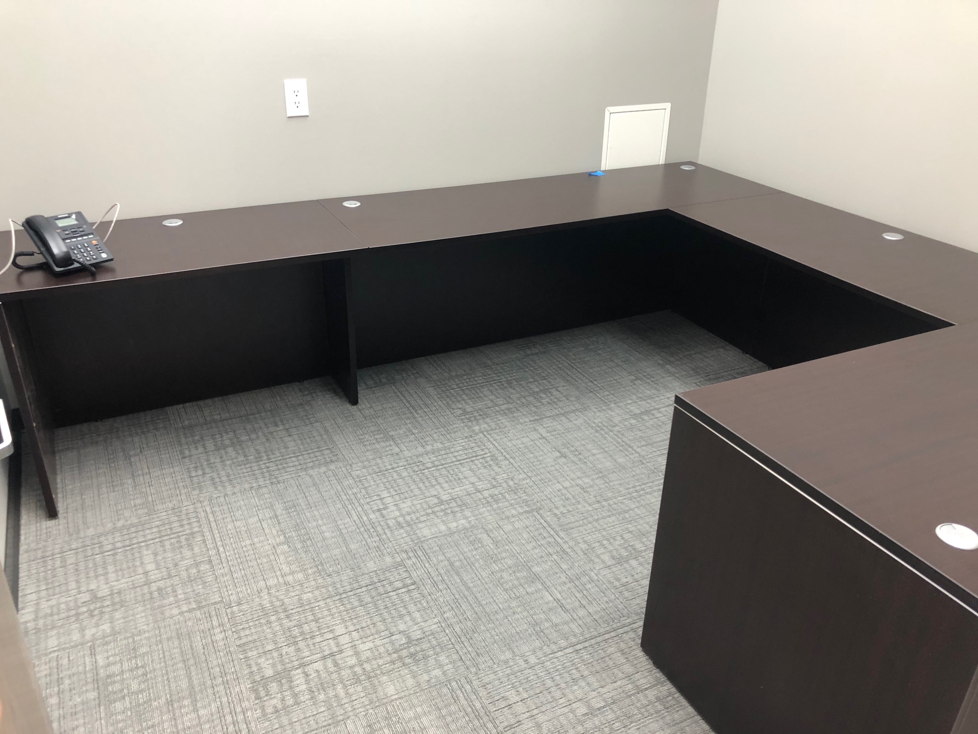 U-Shaped Desk in room with large windows
